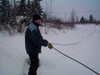 Blue Mason helping with the cable lines. You had to drag the cable lines through the deep snow from one hydro pole to another.