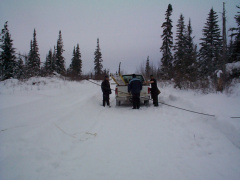 checking out the equipment. Thats Edwins truck the're using.