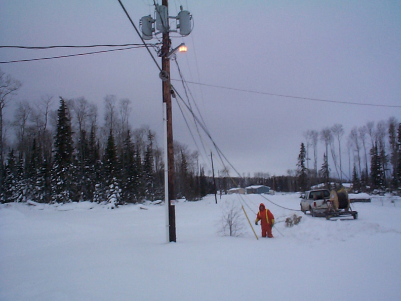 Here we are. See that guy in orange. he will be climbing up on the hydro poles to get the cables up.