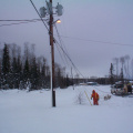 Here we are. See that guy in orange. he will be climbing up on the hydro poles to get the cables up.