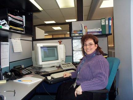 Nathalie - one of the Telecare Registered Nurses at her station, taking calls. She has been with the service for more than 2 yea