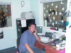 Head Start Children Centre Manager Warren Meekis  using      his office IP phone.