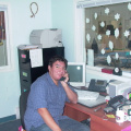 Head Start Children Centre Manager Warren Meekis  using      his office IP phone.