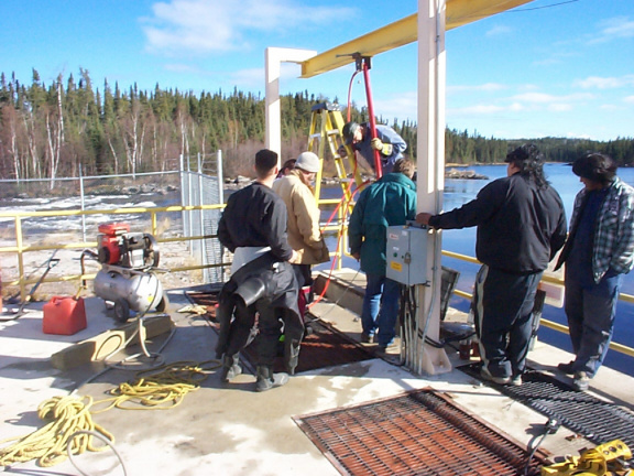 They are lowering 400 lbs. beams into the &quot;intake turbine&quot;.  The beams kept on surfacing.  They had to put extra press