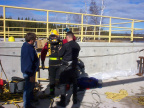 A diver goes into to assess the damage and to clean up the debris that was lodged in the dam