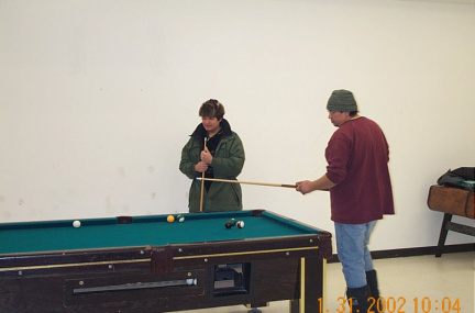 Chief George Kakekaspan and councillor
Robert Thomas playing a game of pool while waiting for the session to start.