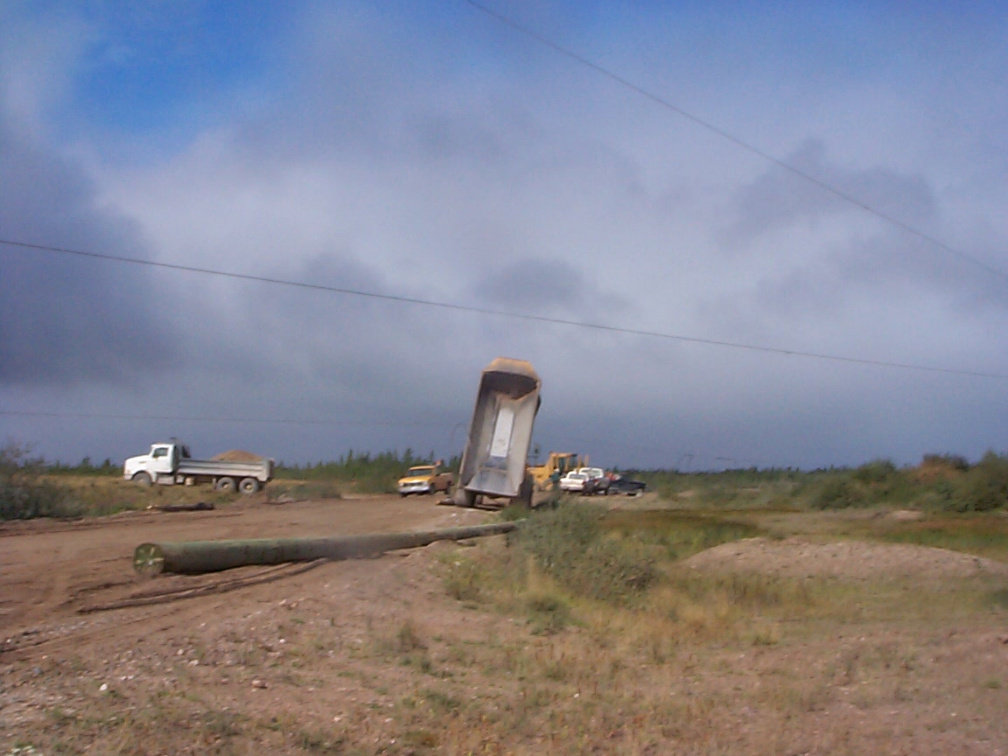 The culprit, a rock truck didn't lower its dump.