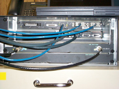A closeup of the uBR7223 connections. The console and aux ports are connected to the RSM-3 for remote access.