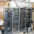 The cable headend equipment. The upconverter is in the left most rack at the very top. The other equipment are satellite receive