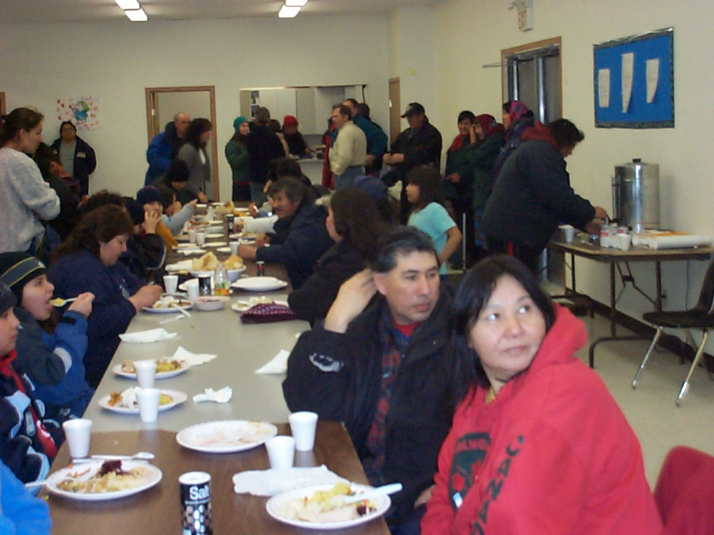 Angus Miles' parents watching the video conference connection with the feast taking place in North Spirit Lake at the same time