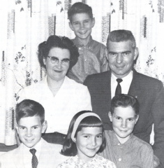 Peggy Sanders and her family- Front row, left to right, Peter, Christine, Kenny. Middle row: Peggy, her husband Don. Back row: J