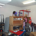 kids playing in the equipment room at the school gym.