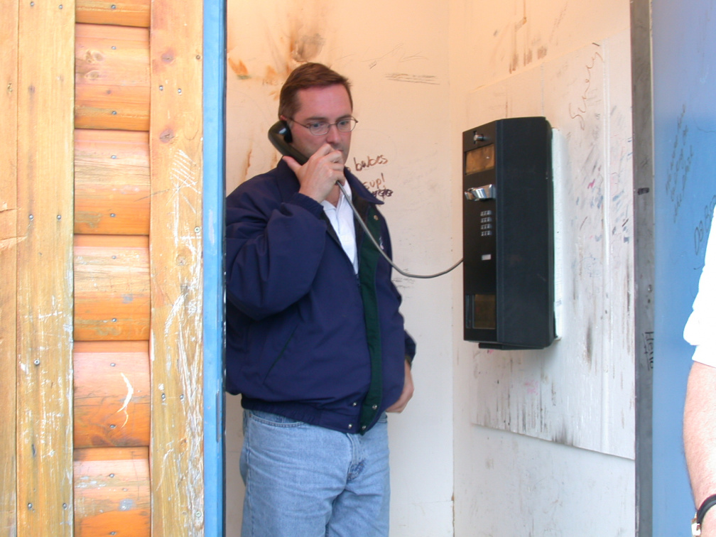 Paul testing the single toll phone in the community (probably phoning Bell to tell them that they can easily add more lines to t