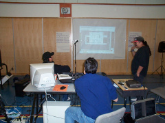 Jesse doing his computer program demonstration. Thats Raymond mason looking on and Blue hiding behind the computer.