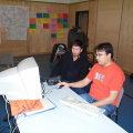 Here's Blue Mason and Jesse Fiddler working hard by the computer which they set up in the gym