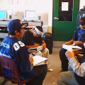 The men doing their English group work.