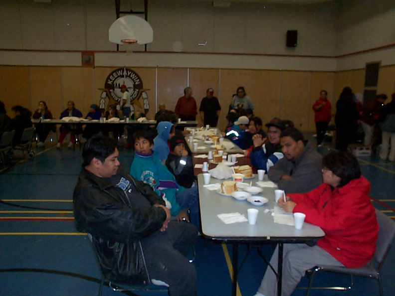 Theres the community members waiting to be served. On the right that is Chimo and in the red Mrs. Chimo.