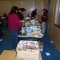 More food. Volunteers are serving plates to the community.