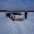 There was blowing snow the night before which covered most of the winter road on the ice.l
