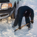 Out taxi Edwin Meekis shoveling snow out of the way.