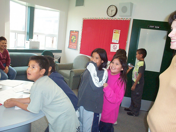 Lined up and looking on, waiting for their turn.