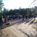 Community members watching from the distance where they were asked to move back to.