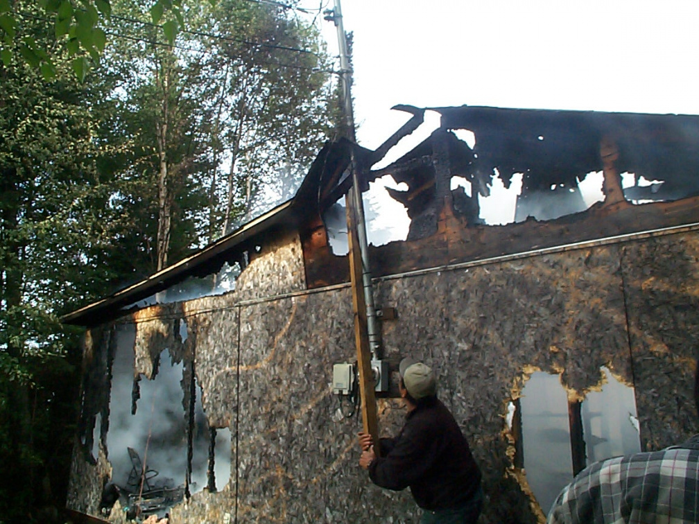 Robbie Robinson, tearing down the power line from the building.