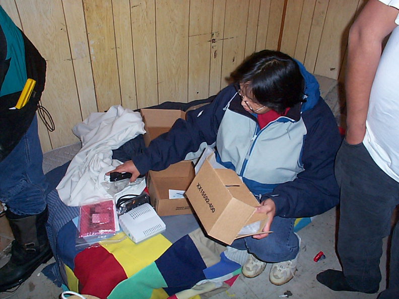 Darlene getting the cable modem ready to be hooked up to the computer