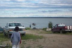 some fisherpersons coming in to get their catches weighed