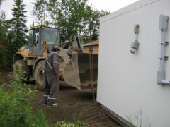 2012-06-20-19-moving-NSL-Cable-Headend-Building-into-place-by-band-office