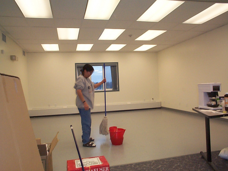 The E-Manager washing the floor at the e-center