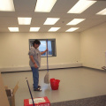 The E-Manager washing the floor at the e-center