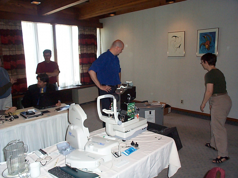 Christine Penner Polle, Regional Telehealth Coordinator, assists in set up of teleopthalmology equipment on display in Thunder B