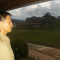 Ayoe Overlooking the Fields from a Longhouse