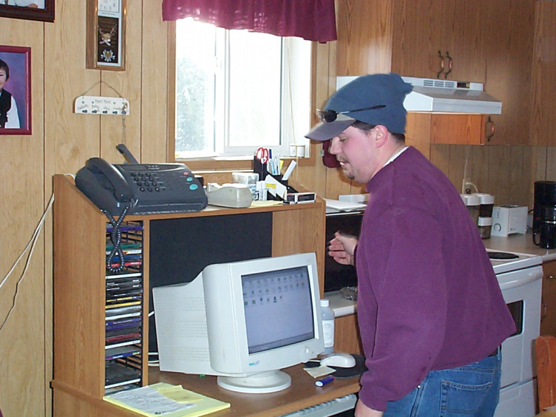Hugh working on getting the cable modem all setup. - aag.jpg aag.jpg