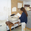 Karen Monias at the fax machine.