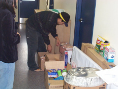 Our youth cap worker looking through the food that came in. Hes gonna cook something and we got to get the stomach pumps ready.
