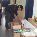 Our youth cap worker looking through the food that came in. Hes gonna cook something and we got to get the stomach pumps ready.