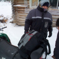 Peter Morriseau tying up here pack sack to the back of the skidoo. Alot of preparations is needed before you go on a long skidoo
