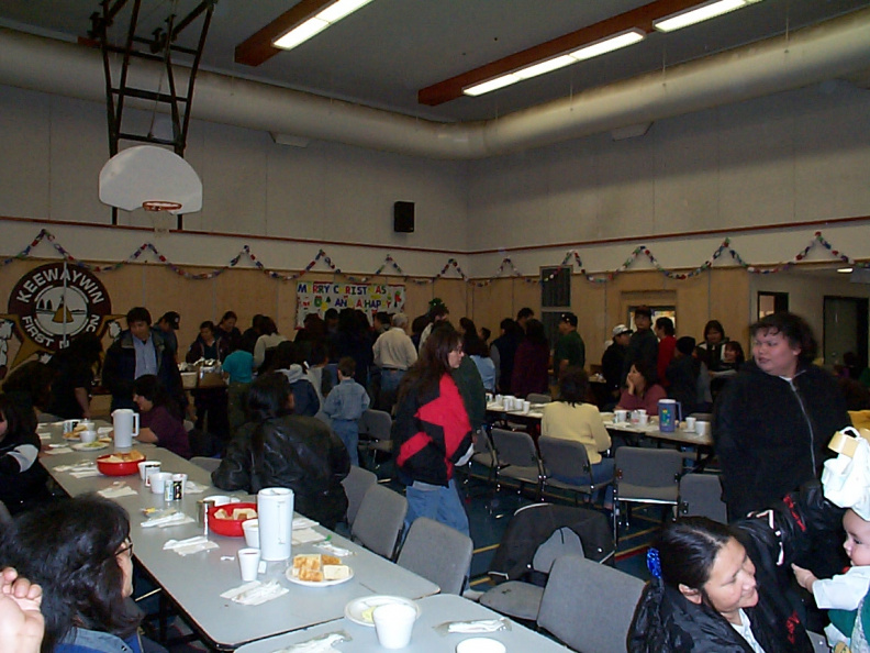 People getting up to get in line for the food.