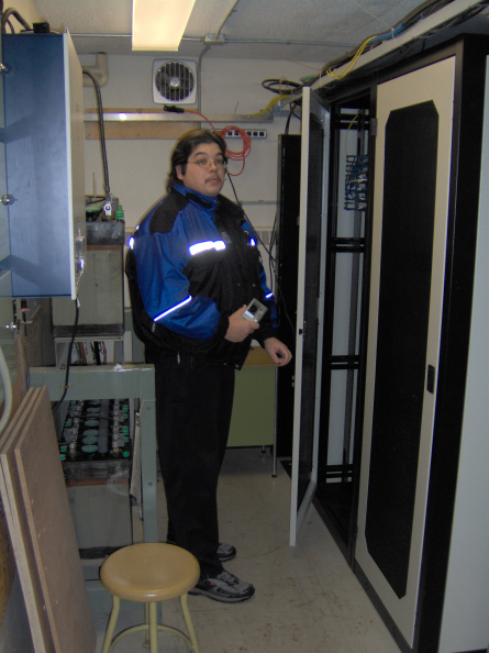 Terry Moreau standing in front of the K-Net rack at Lakehead Universities Braun building.