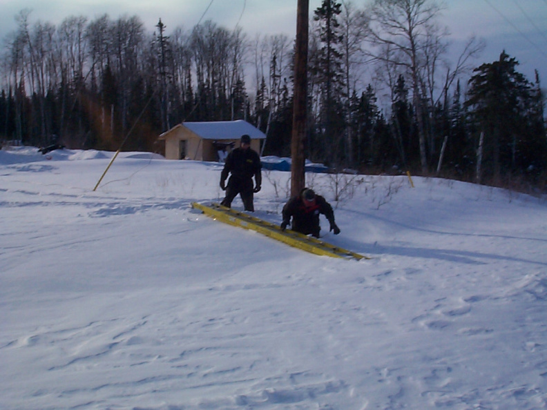 And here is Raymond Mason trying to get ladder out. And Joseph standing beside Raymond who is knee deep in snow.