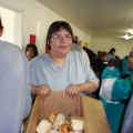 Delilah Rae passing out bannock to the people