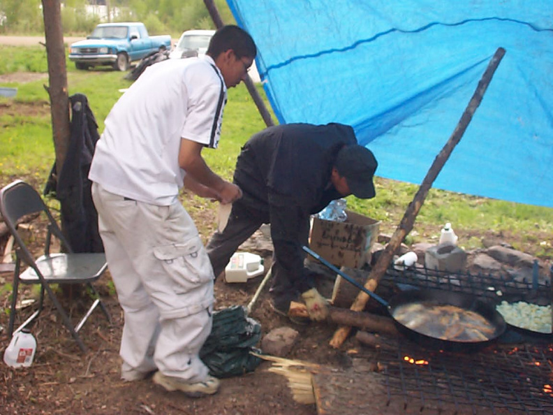 Wayne and Davie cooking fish