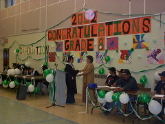 Another student recieving diploma.Congratulations to all graduates.