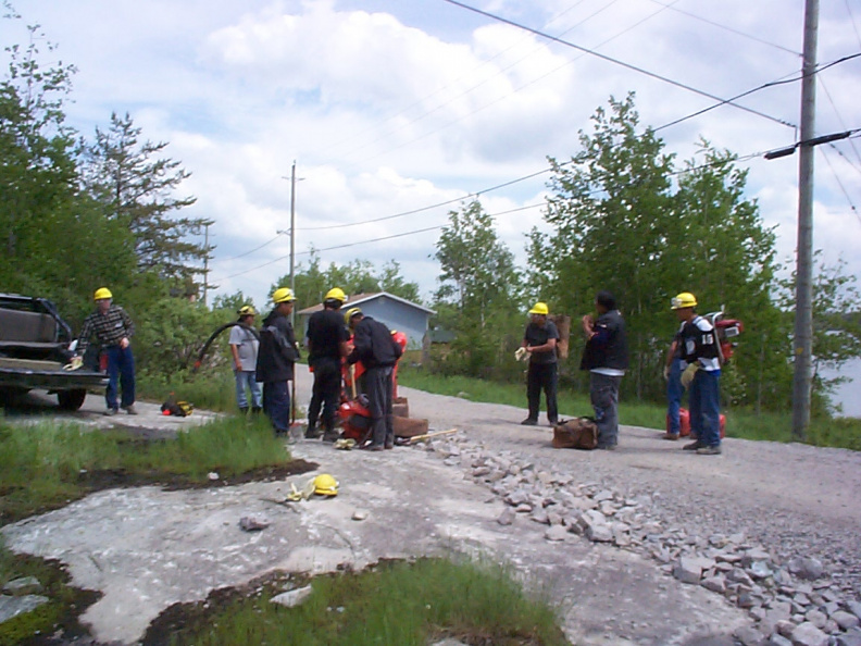 Going through the equipment before going down to set up a pump.