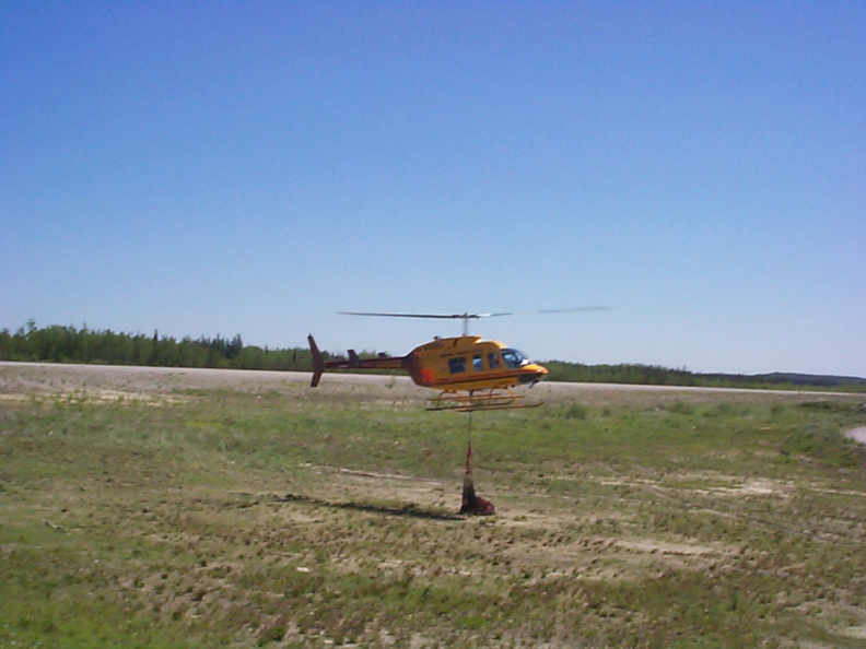 Helicopter with the cargo net set to release.