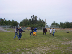 The men coming to the home stretch,3legged race.