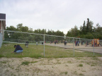 The womans money hunt, this lady is searching on the ground,cause it could be any where.Its here somewhere inside the fence.