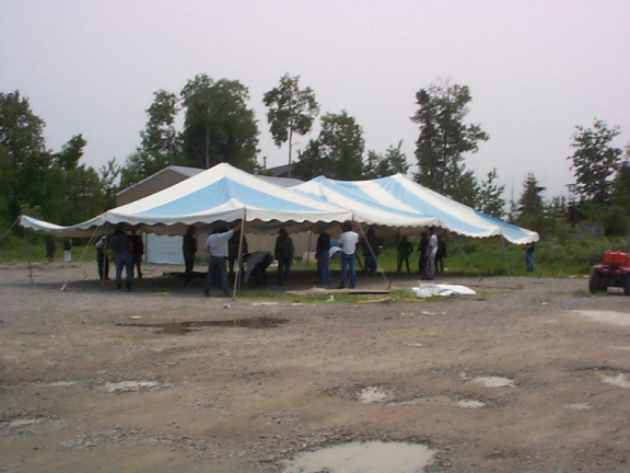 Men putting up this tent.Gospel tent meeting this weekend.